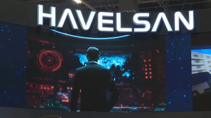 HAVELSAN logosu ve NATO bayrağının bir arada bulunduğu görsel.
